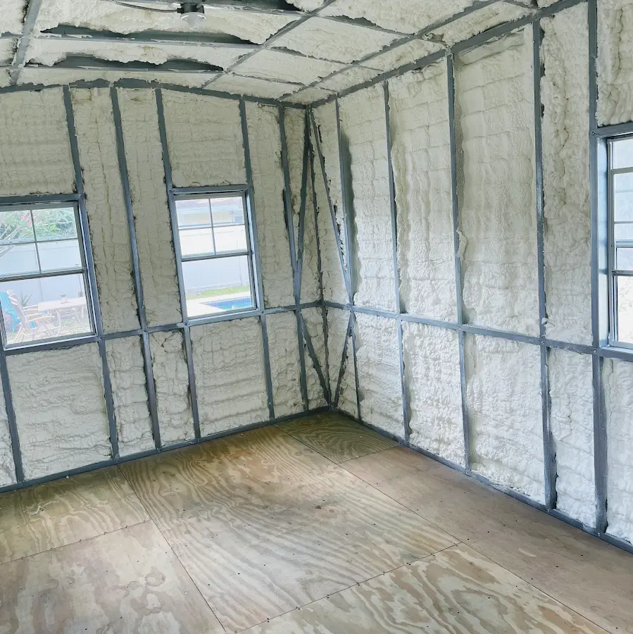 Closed-cell spray foam insulation applied to wall cavities in a residential project in Polk City